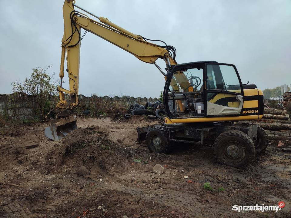 Koparka kołowa JCB js 130 w cat case komatsu Brodnica