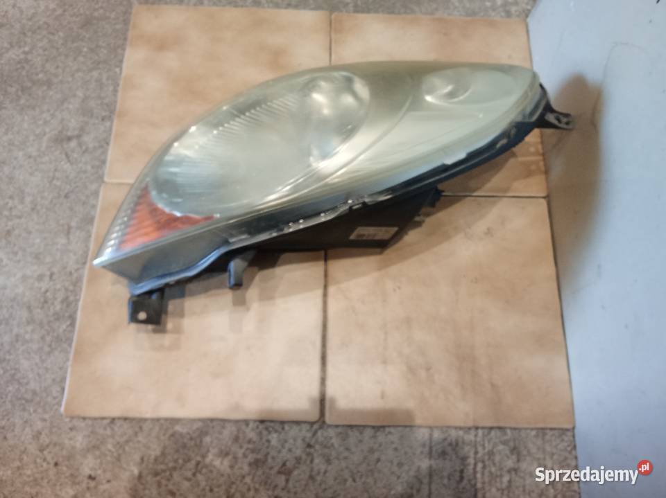 Nissan note e11 reflektor prawy orginal Oświetlenie Wrocław