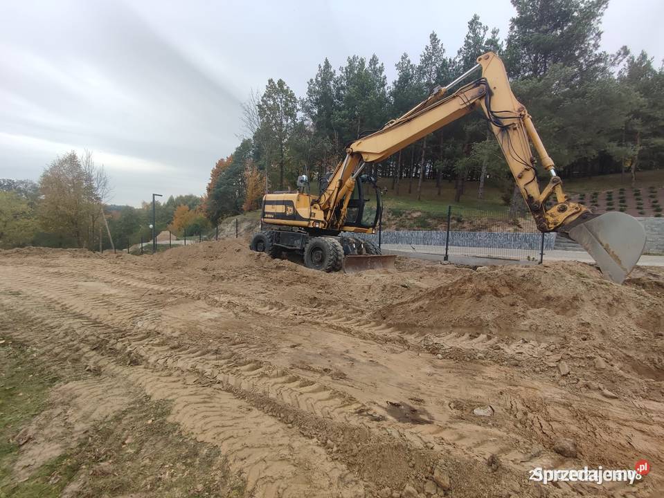 Koparka kołowa JCB js 130 w cat case komatsu Koła Brodnica