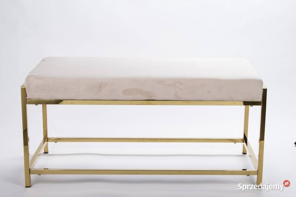 Beżowa ławka siedzisko puf na złotych nóżkach
