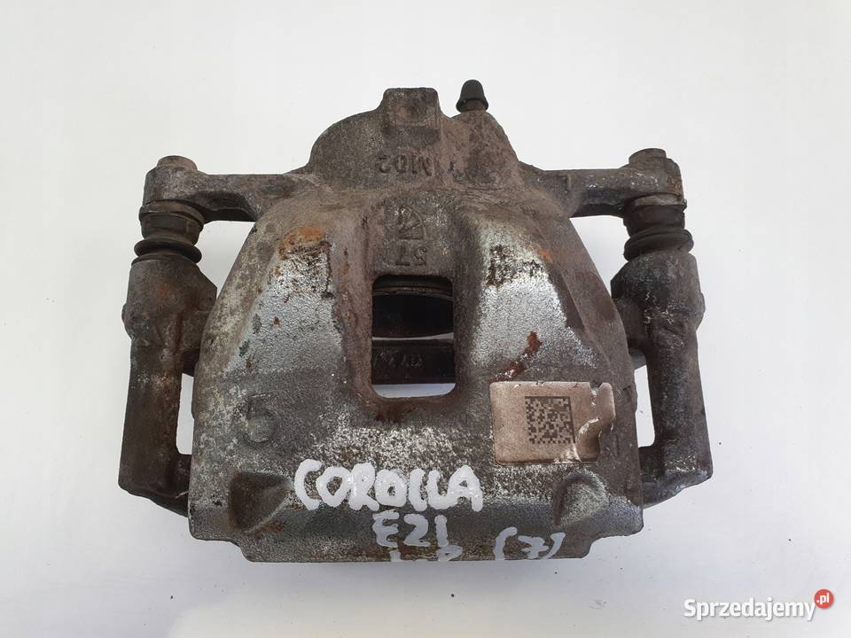 Toyota Corolla XII E21 PRZEDNI ZACISK HAMULCOWY Rudka