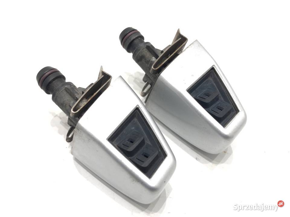 SPRYSKIWACZ REFLEKTORA LEWY PRZÓD BMW E83 Van