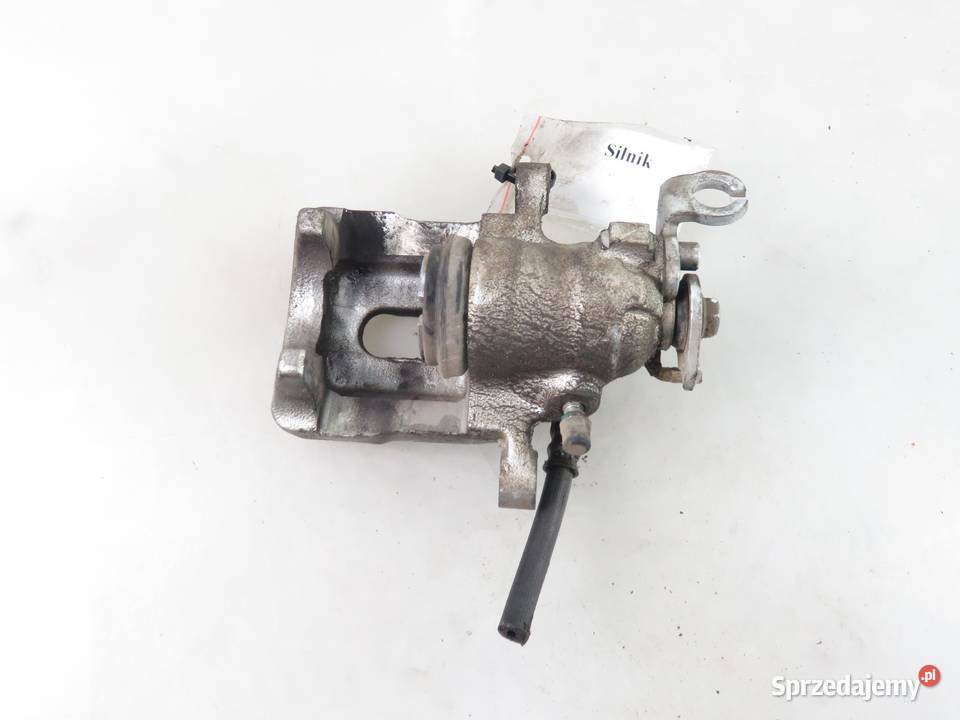 ZACISK LEWY TYŁ VOLVO V40 I