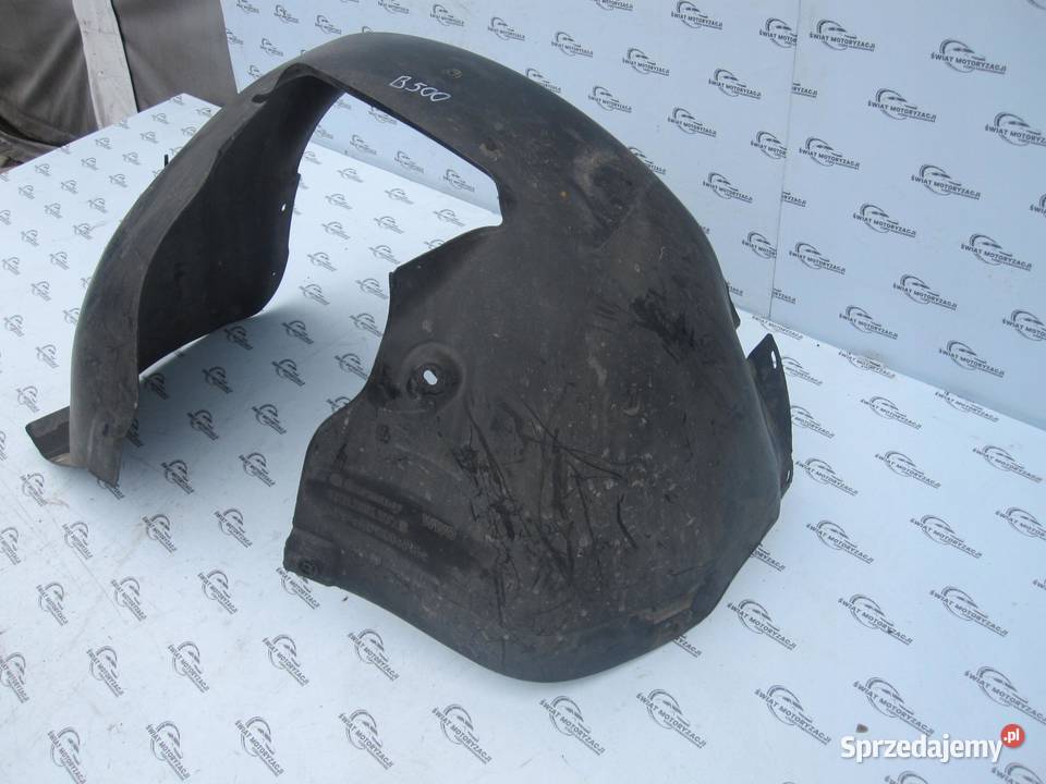 VW GOLF V 04r nadkole lewe przód 1K0805977B