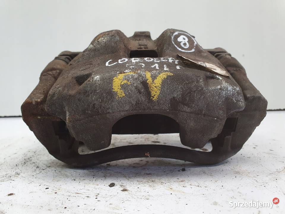 Toyota Corolla XII E21 LEWY PRZEDNI ZACISK Rudka