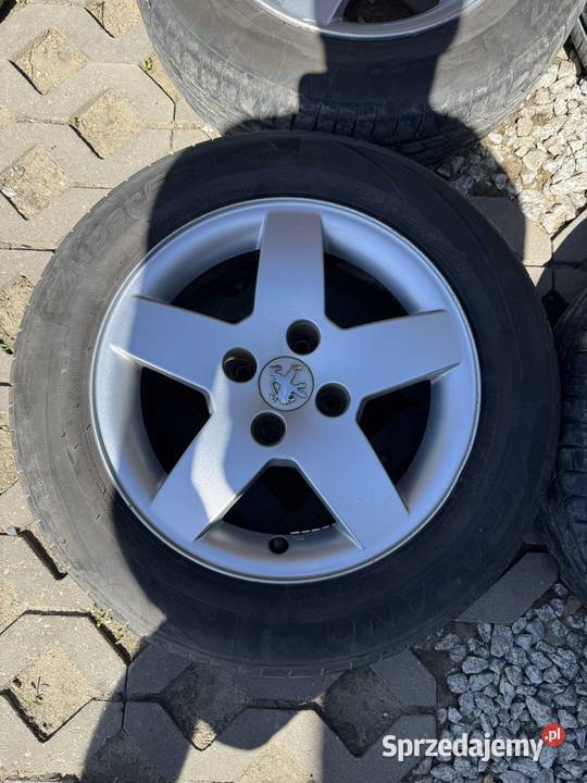 Felgi Peugeot 4x108 opony 1856515 2023r 206 207 Krępiec