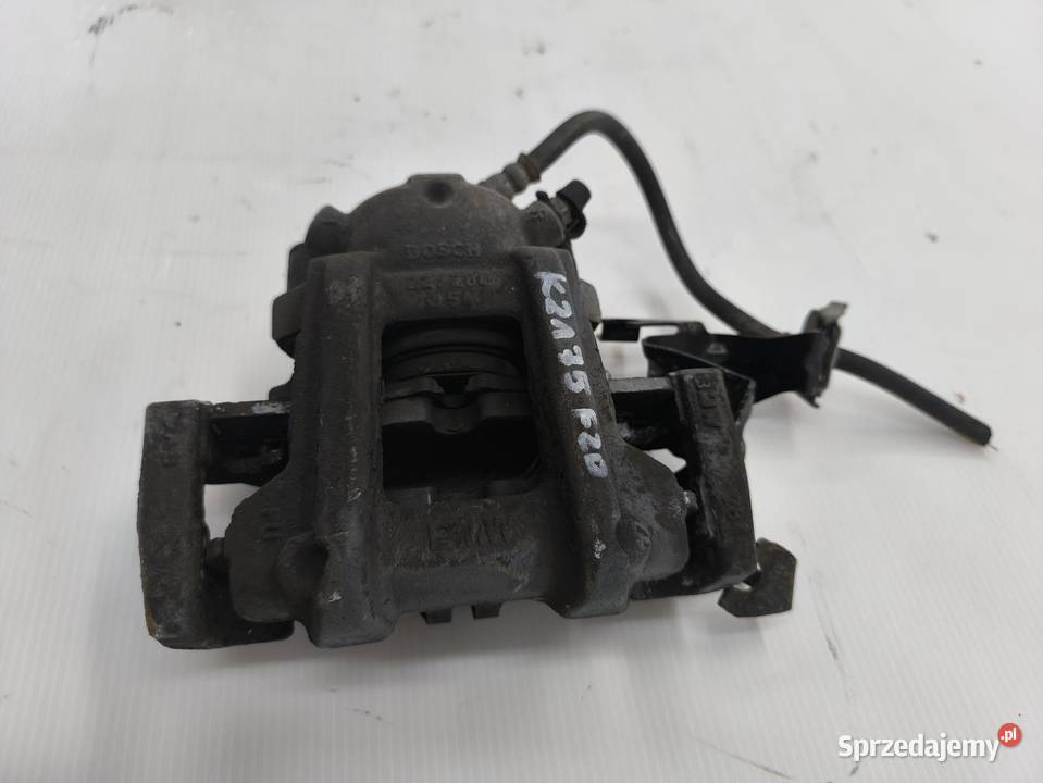 ZACISK LEWY PRZÓD BMW F20 F21 116i