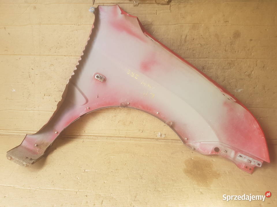 Suzuki Ignis MH 0410 błotnik przód przedni