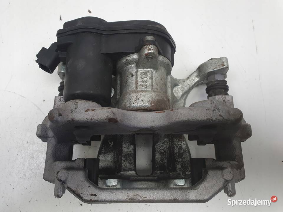 Toyota Yaris IV TYLNY ZACISK HAMULCOWY lewy tył Nawigacje fabryczne