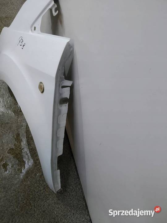 BŁOTNIK LEWY PRZÓD EN BIAŁY Ford Transit Courier osobowe Błotniki