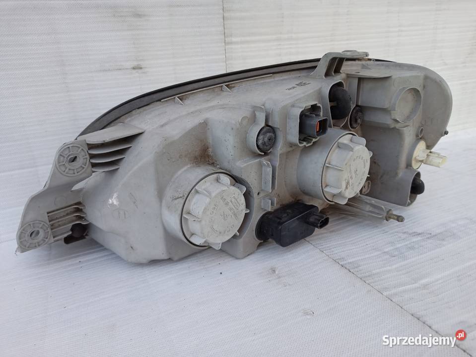 Kia Carnival 1 I lampa przednia prawa reflektor