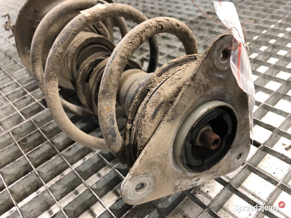 AMORTYZATOR LEWY PRZÓD ZE SPRĘŻYNĄ RENAULT CLIO