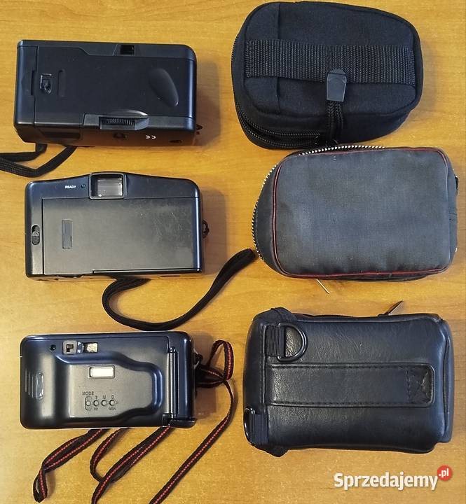 Trzy aparaty fotograficzne z futeralami Skoczów