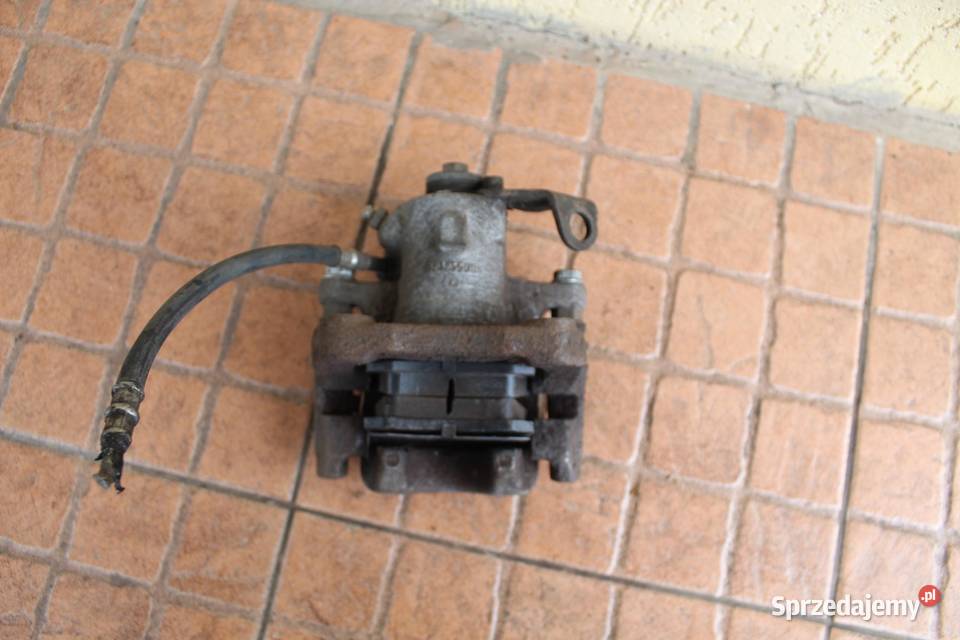 ZACISK HAMULCOWY PRAWY TYŁ VW BEETLE 20B