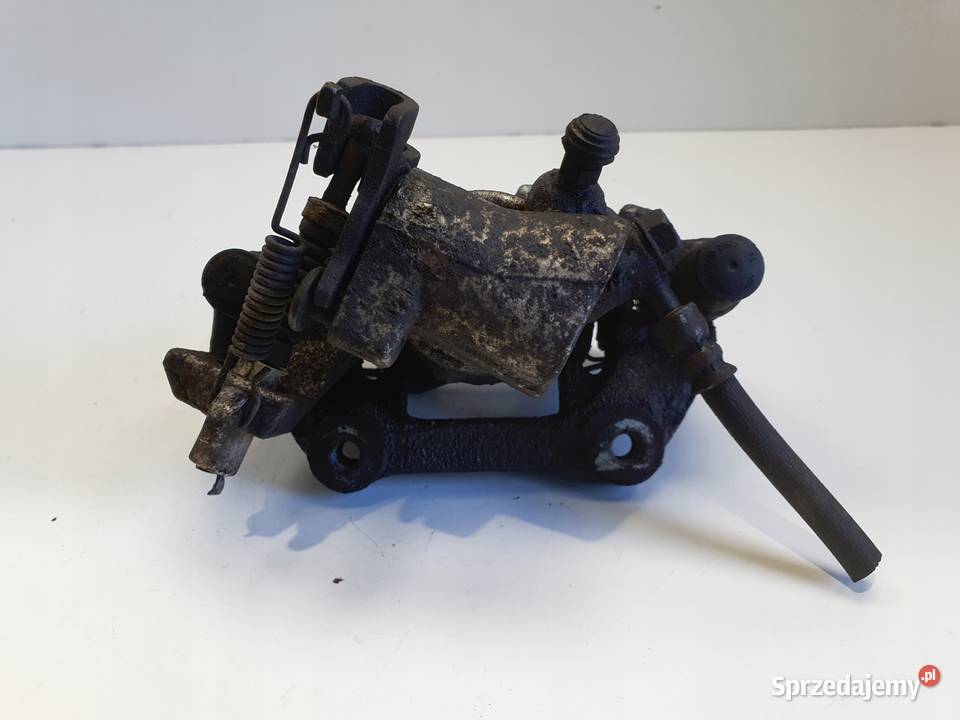 Toyota Yaris III TYLNY ZACISK HAMULCOWY lewy tył Rudka