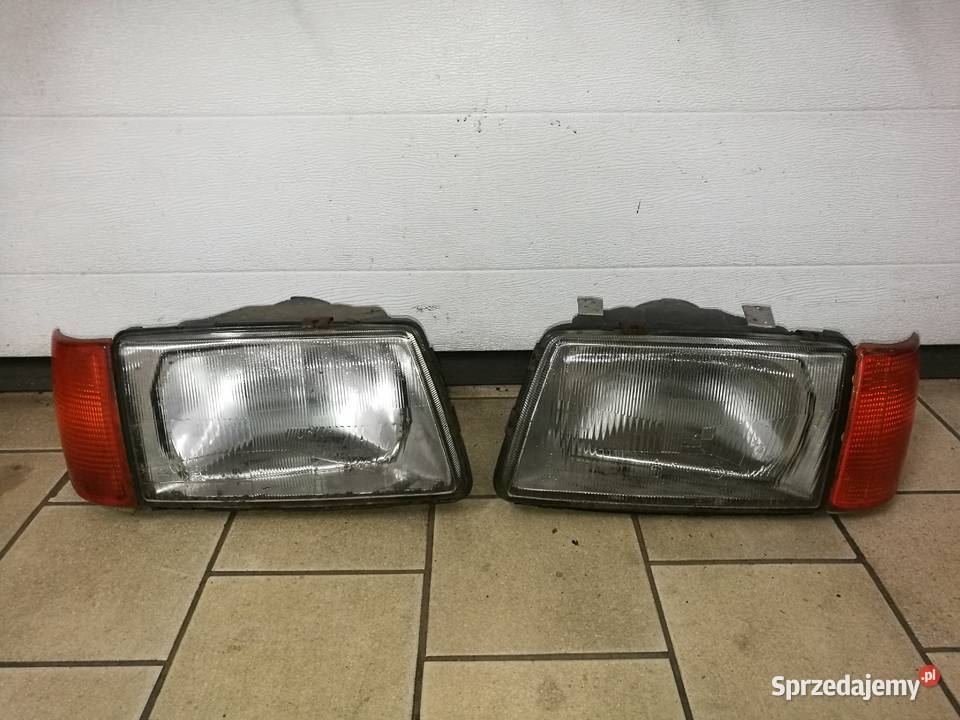 Reflektor prawy lewy kierunek Audi 100 23R5 Oświetlenie Biłgoraj