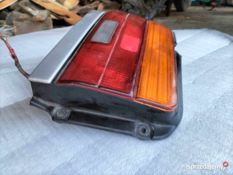 LAMPA TYŁ TYLNA TOYOTA COROLLA E10 LEWA Kamień-Kolonia