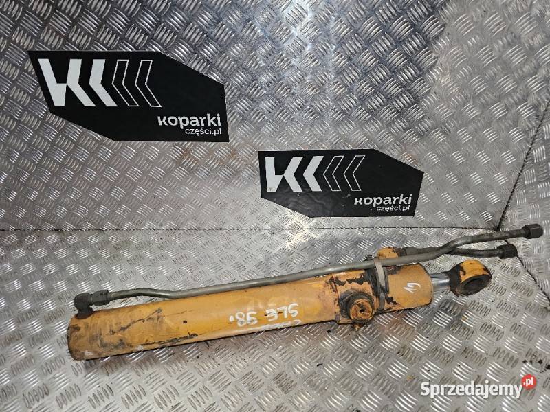 Siłownik hydrauliczny otwierania przedniej łyżki