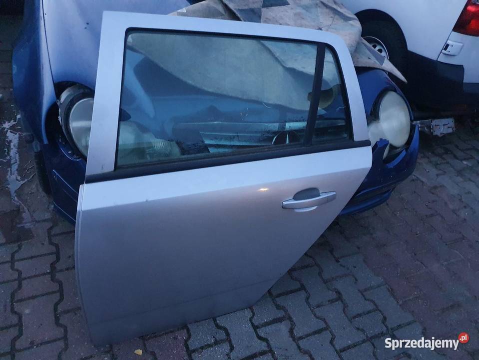 DRZWI LEWY TYŁ OPEL ASTRA III H KOMBI SREBRNE