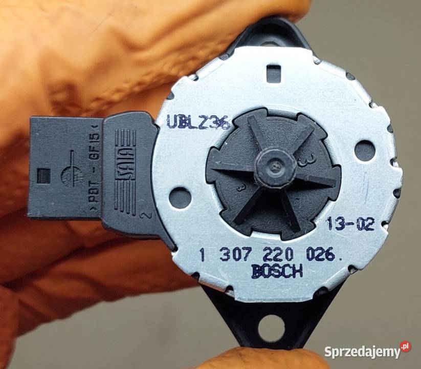 SILNICZEK REGULACJI LAMPY OPEL ALFA BMW XENON osobowe Mielęcin