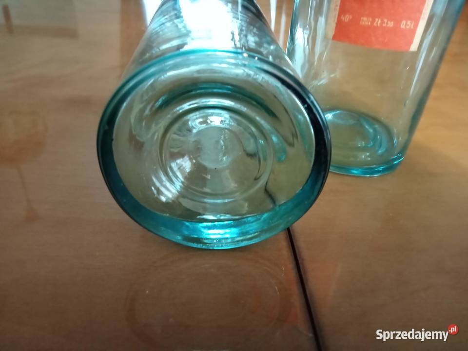 Butelki przedwojenne z okupacji z etykietami Porcelana i szkło Łódź