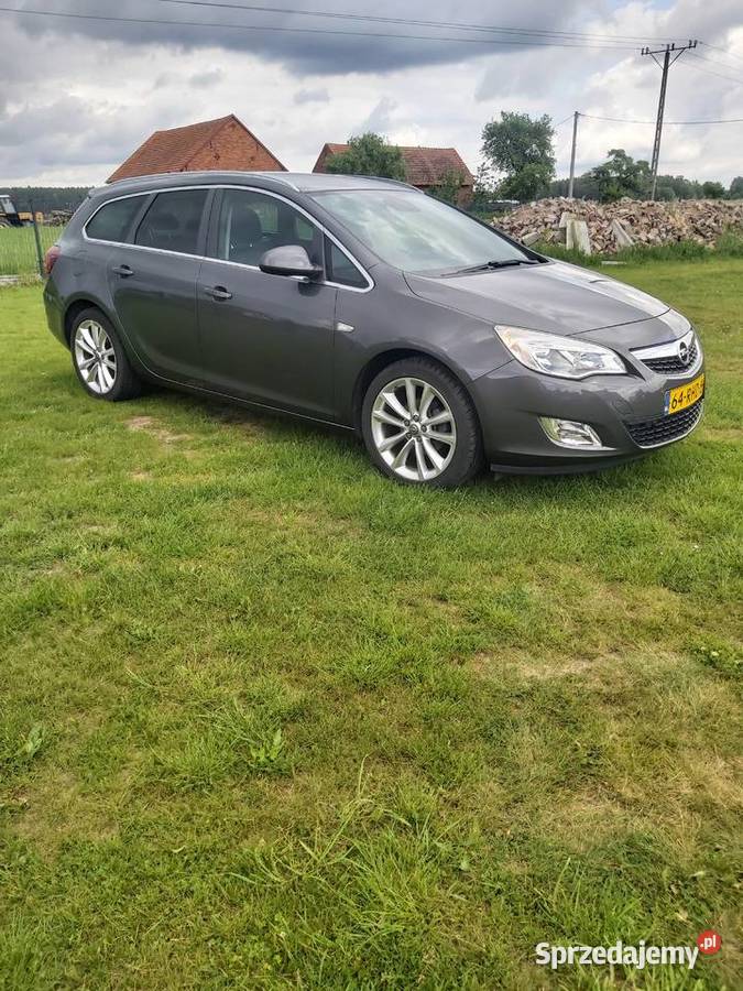 Astra J Kombi Cosmo Skóry fotele AGR hak