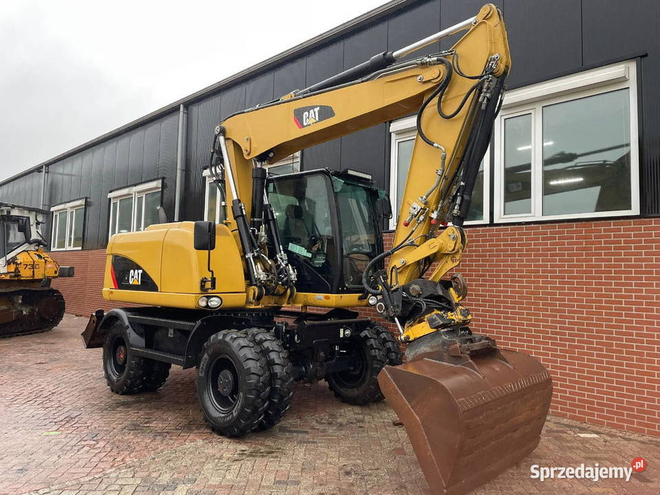 Koparka kolowa caterpilarr M 313 D Koparki Warszawa sprzedam