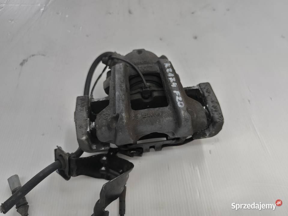 ZACISK LEWY PRZÓD BMW F20 F21 116i