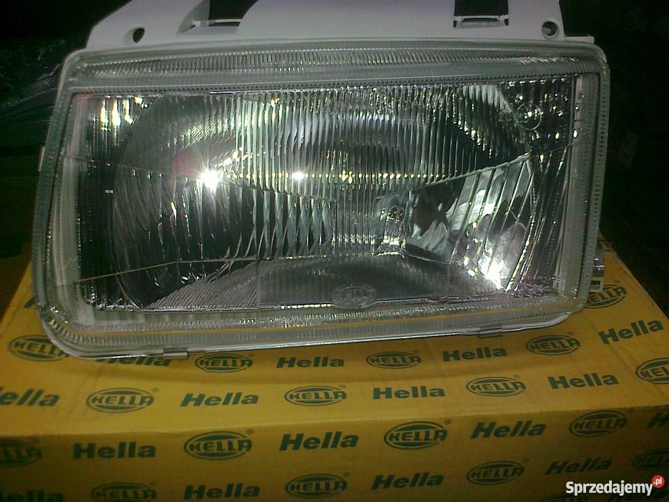 VW POLO 94 REFLEKTOR H4 LE REG ELE NOWY HELLA Pruszków