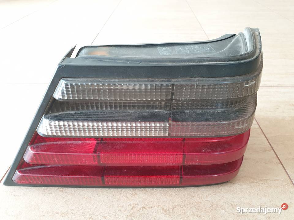 Mercedes W124 sedan lampa prawy tył ciemna Hella Legnica