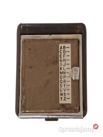 Stara metalowa książeczka telefoniczna