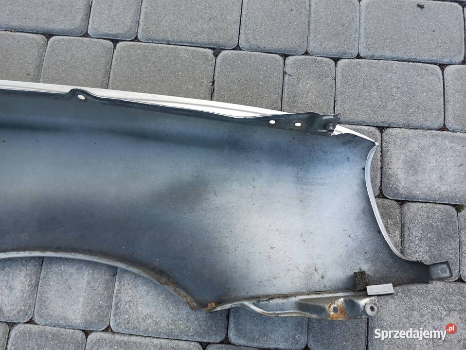 Nissan Micra K11 błotnik lewy przód srebrny Bolesławiec
