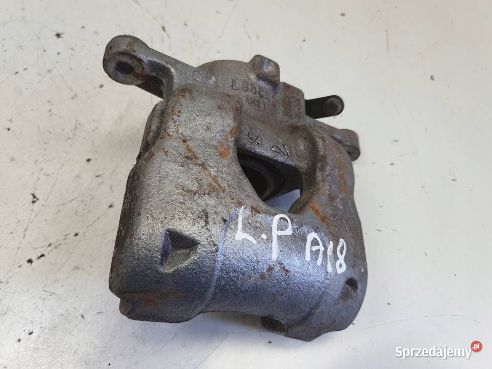 Nissan Micra K14 PRZEDNI ZACISK HAMULCOWY lewy Rudka