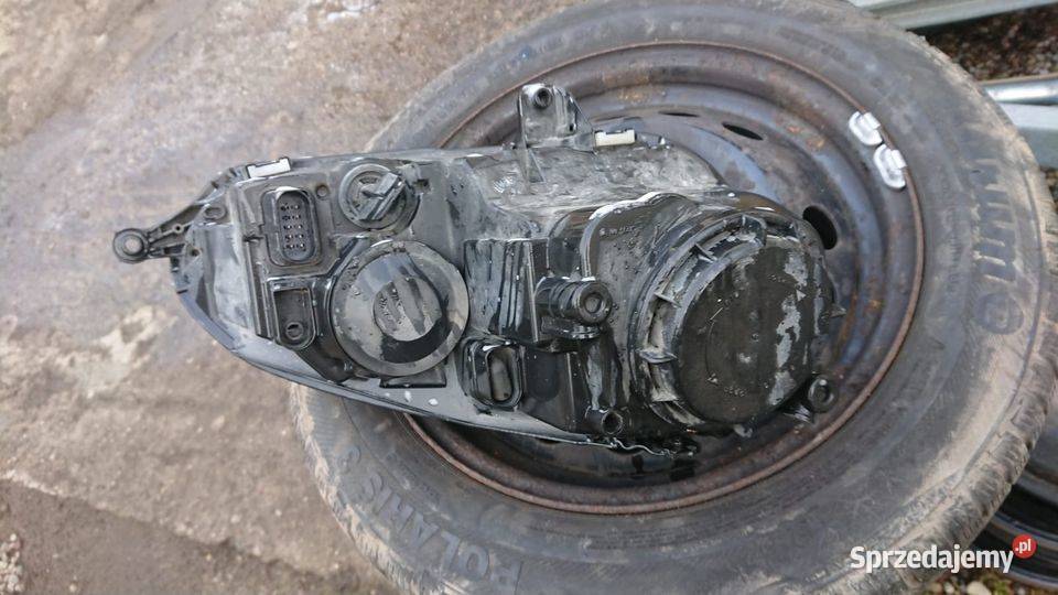 Oryginalna lampa przód Golf V czarny środek Lewa Garcz