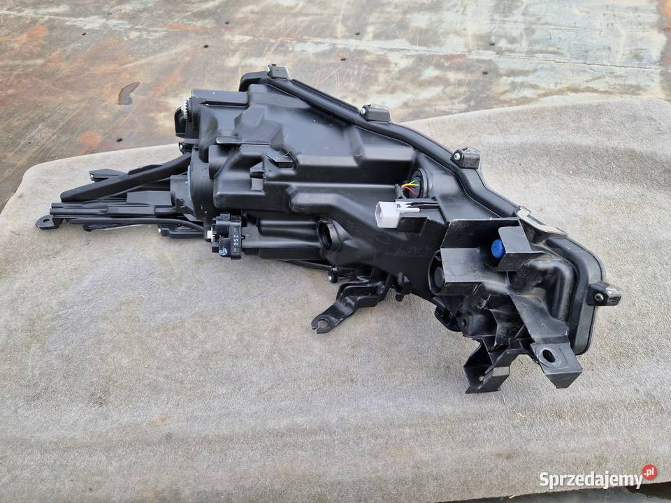 Toyota Corolla E21 sedan reflektor ORG EU Lampy przednie