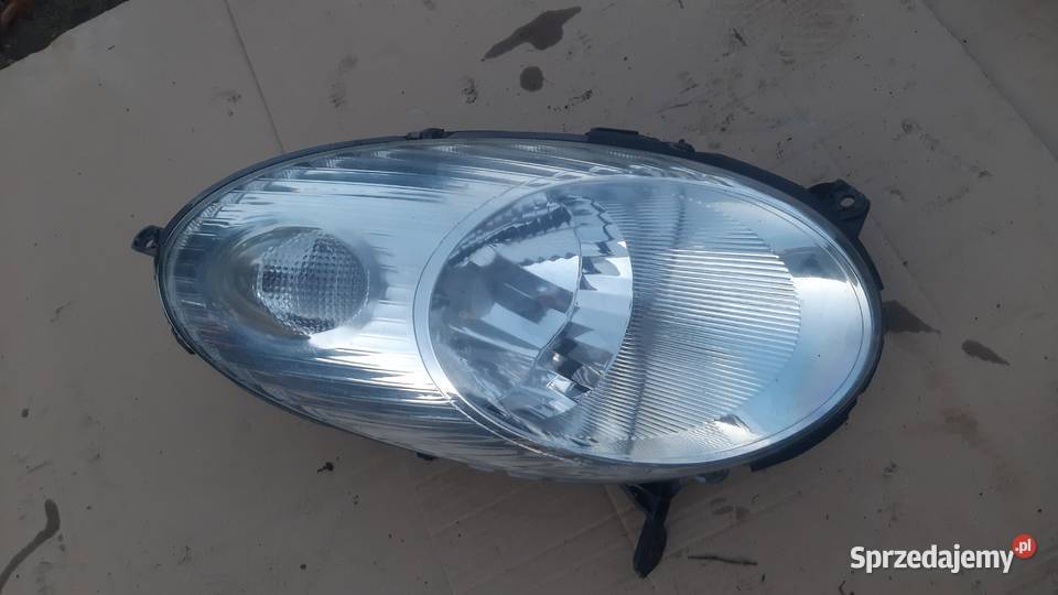 lampa prawa przednia Nissan Micra k12 89900075 osobowe Lampy przednie Oświetlenie Dębno