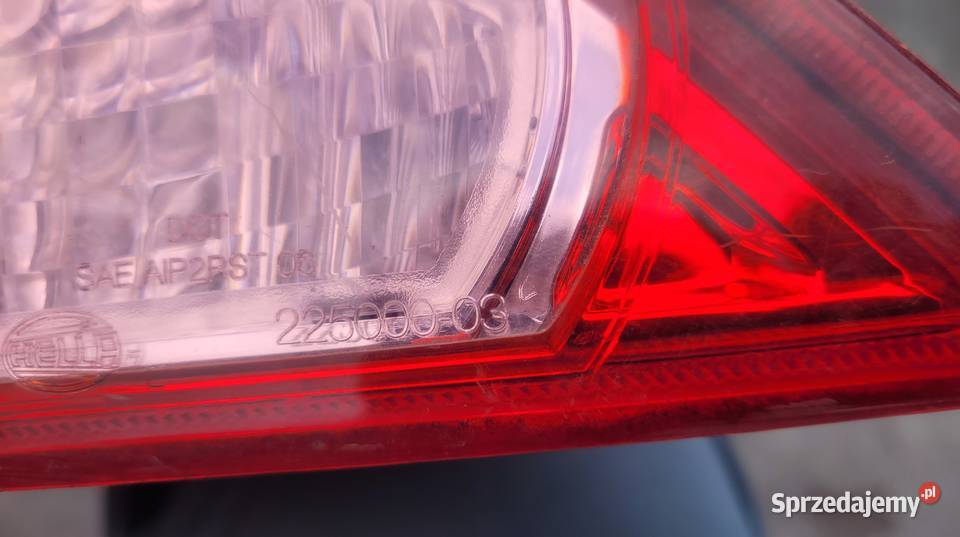 NISSAN TIIDA 5D LAMPA TYŁ LEWA 26555EM01A HELLA Ruda Śląska
