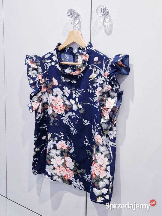 Praktycznie nowa kwiecista bluzeczka kolorowy