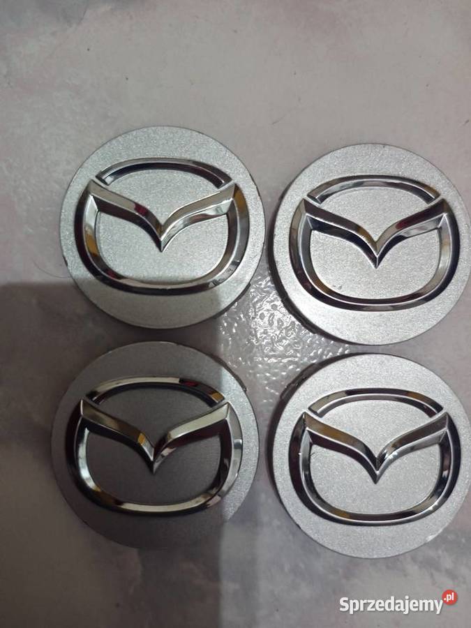 Oryginalne kapsle dekielki do Mazdy Opony i felgi