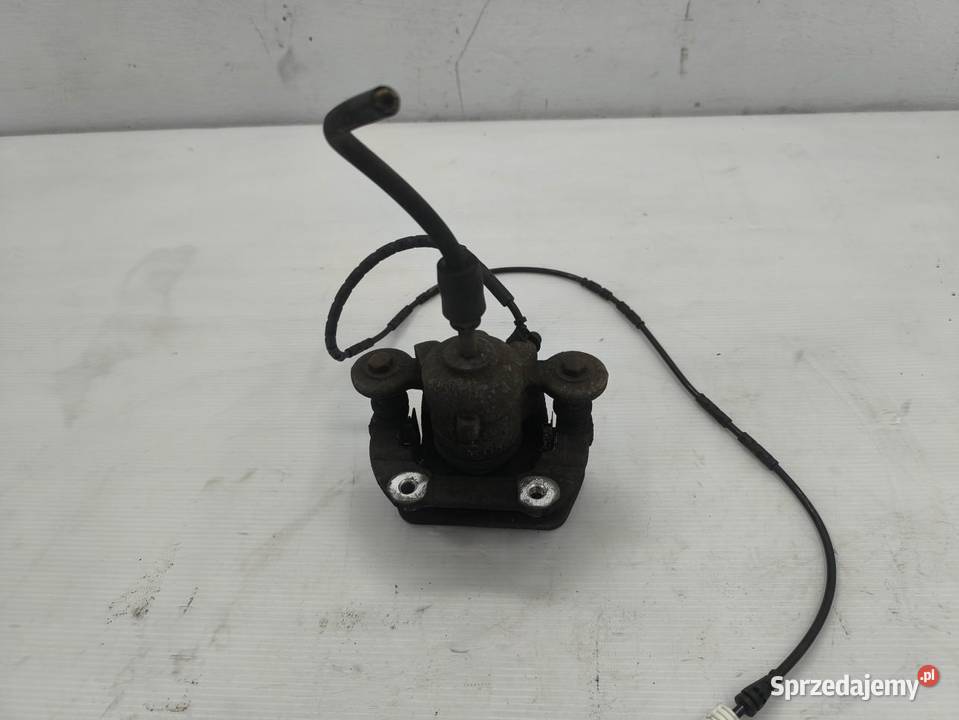 ZACISK LEWY PRZÓD BMW 1 E87 E81 LIFT 16