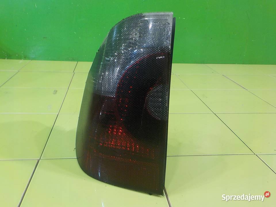 BMW X3 E83 30 B 04r 5D lampa lewa tyl Suków