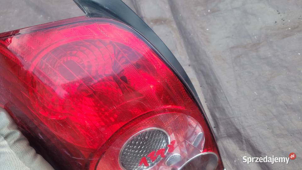 TOYOTA AVENSIS T25 LIFT FL KOMBI LAMPA LEWA TYŁ Lampy przednie Ruda Śląska
