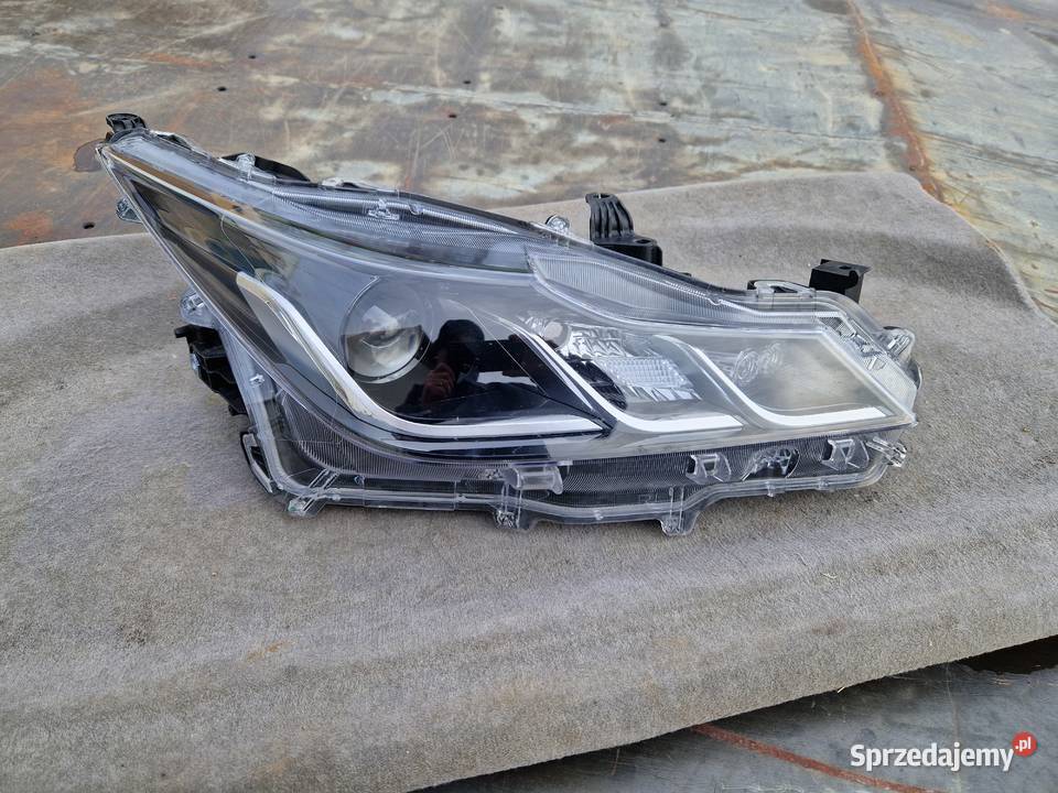 Toyota Corolla E21 sedan reflektor ORG EU osobowe