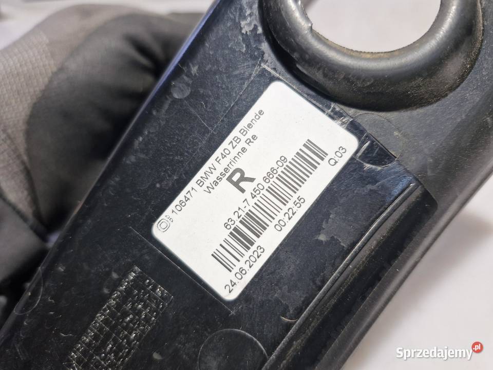 7450666 BMW F40 OSŁONA RYNIENKA OBUDOWA LAMPY osobowe