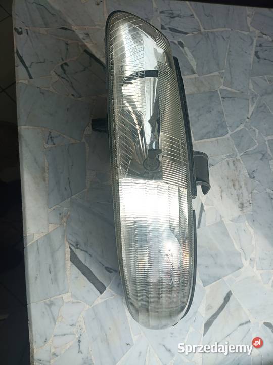 lampa chrysler grand voyager 1997 lewy przód Szydłowiec