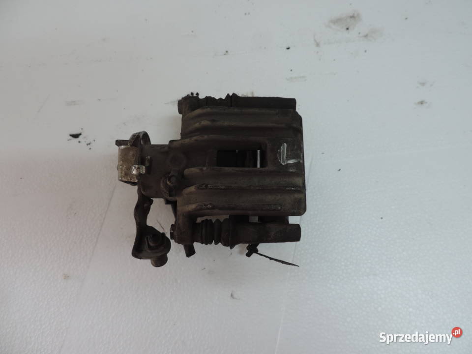ZACISK HAMULCOWY LEWY TYŁ TYLNY AUDI A4 B5 19