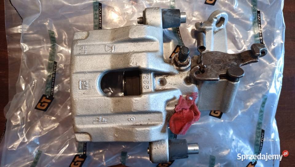 Oryginalny Zacisk GM hamulca LewyTył Opel Vectra Szczerbice