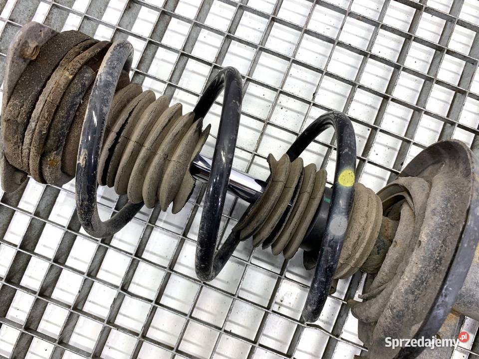 AMORTYZATOR LEWY PRZÓD ZE SPRĘŻYNĄ RENAULT CLIO