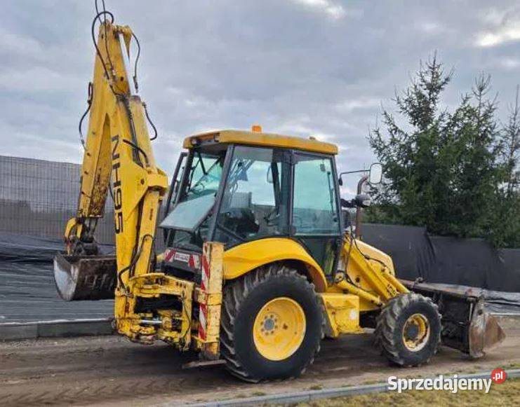 Koparko Ładowarka Holland NH95 BRUTTO Rok produkcji 2000 Koparko ładowarki Dywity