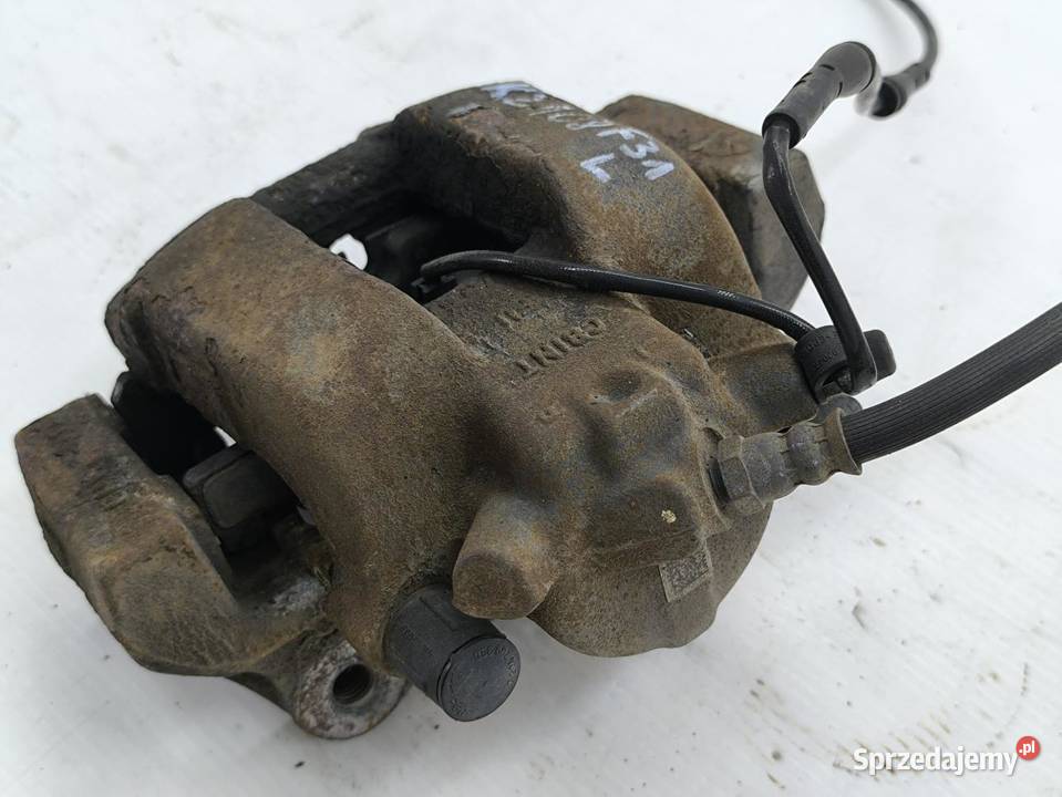 ZACISK LEWY PRZÓD BMW F31 20D LIFT wielkopolskie